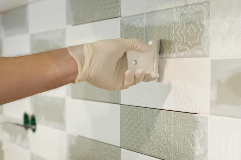 How to regrout tile without removing old grout by applying fresh grout over existing tile joints