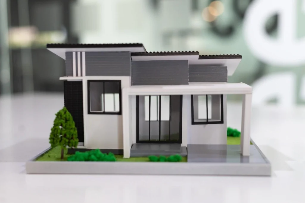 Modern small home designs floor plans model with flat roof, large windows, and compact layout