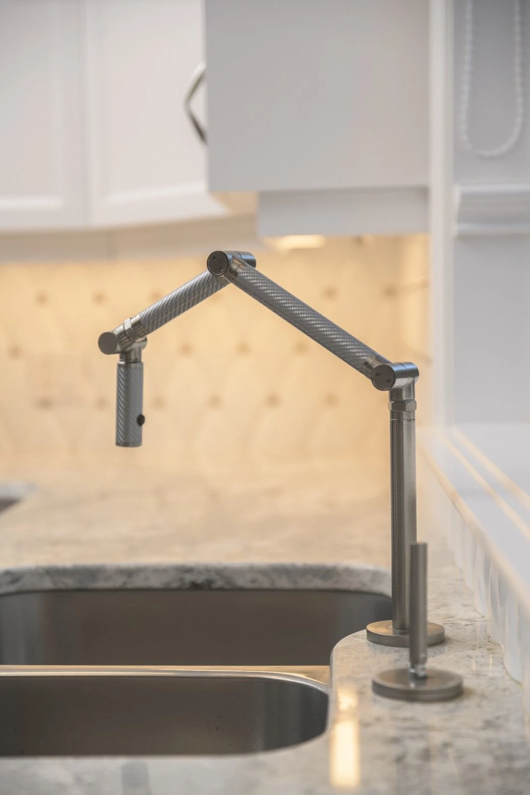 Pot filler faucet showing durable stainless steel material and modern kitchen design considerations